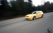 Yellow VW Golf on the Track