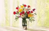 Bouquet In A Glass Vase By The Window
