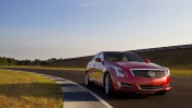 Red Cadillac ATS 2013 on the Road, Front View